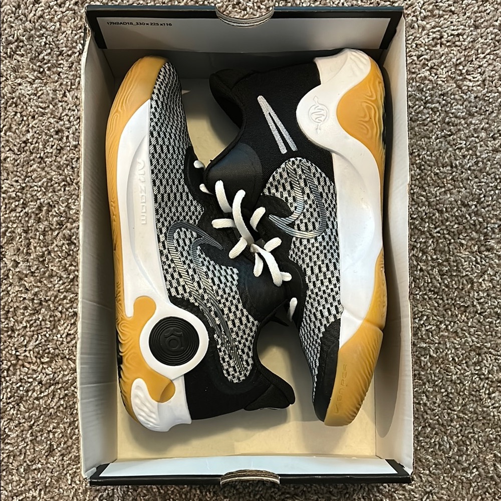 Nike Black and White Sneakers with Gold Accents